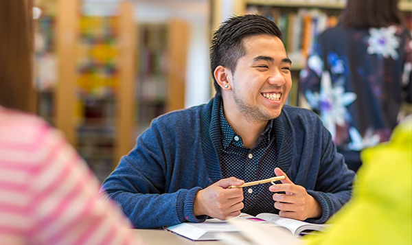  Student listening and smiling in class 