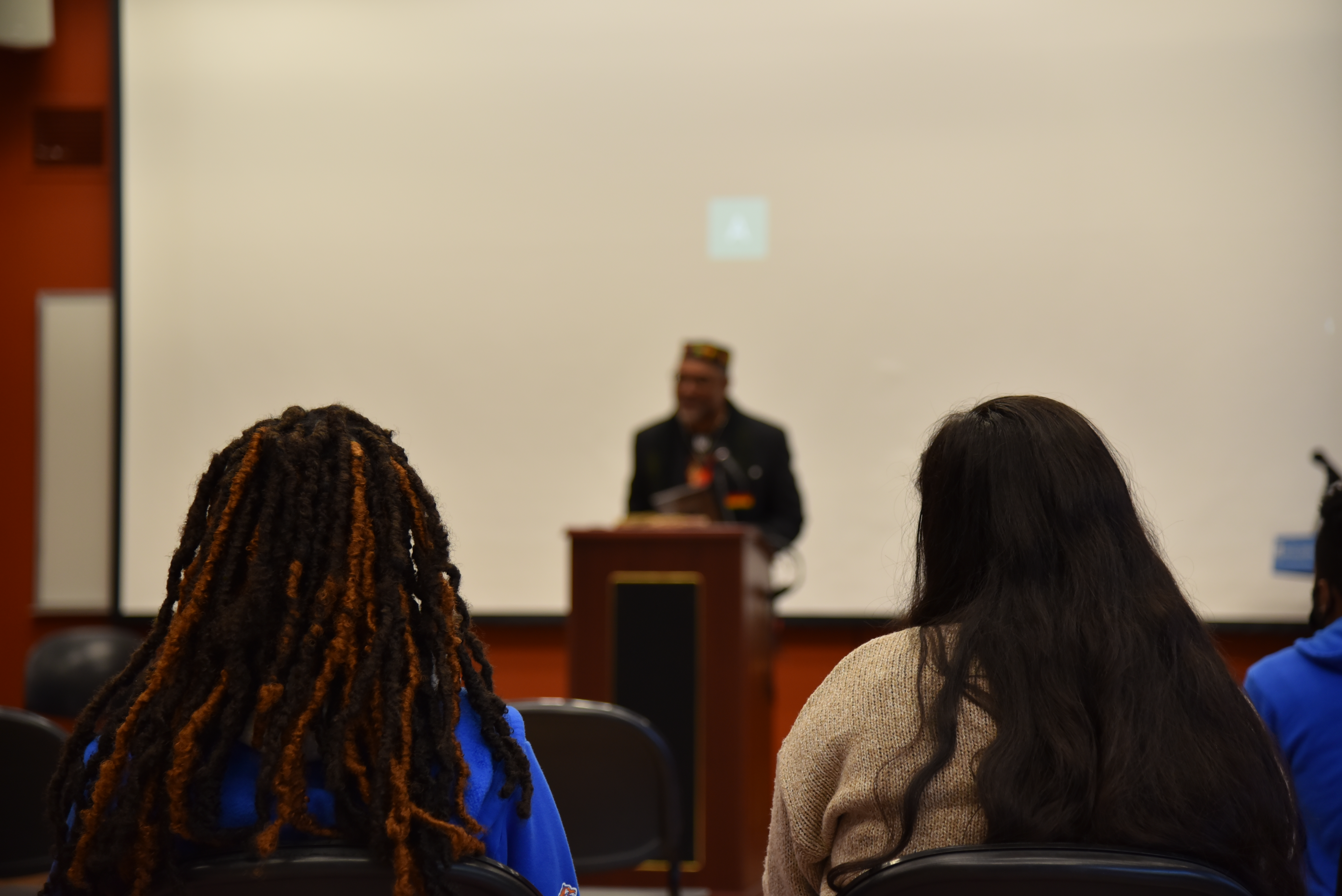 professor Carl Livingstone speaks at a student event